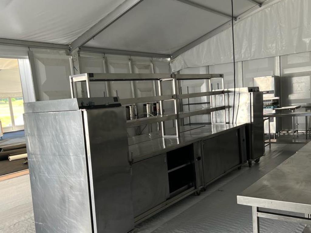 A spacious marquee event kitchen featuring storage, prep, production, service equipment and cold rooms.